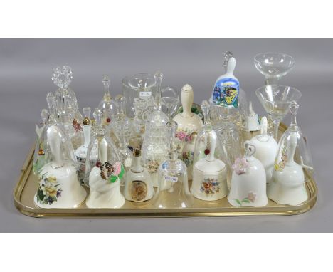 A tray of crystal and ceramic bells to include Zwiesel Caithness and Bohemia examples.