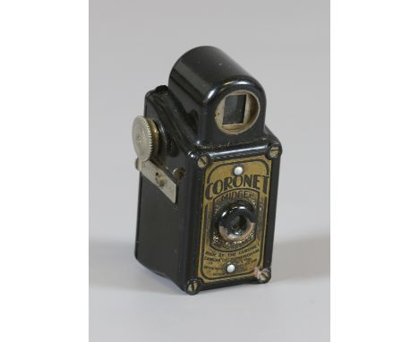 A vintage Coronet Midget bakelite camera.