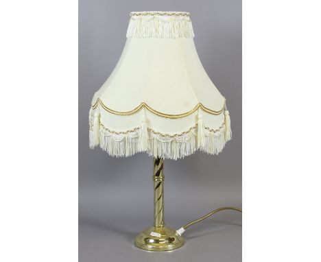 A brass effect rope twist table lamp and shade.