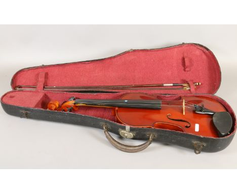 A cased students violin and bow.