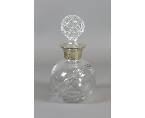 A cut glass decanter with silver collar assayed Sheffield 1996