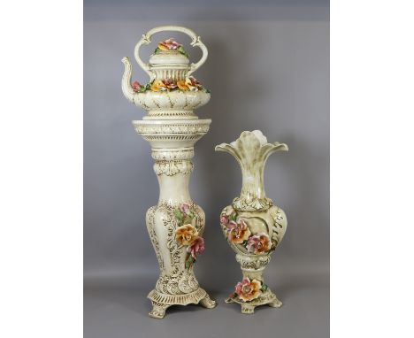 A group of three Italian ceramic pieces to include jardiniere stand, vase and novelty teapot decorated with colourful flowers