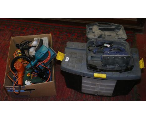 A box and a toolbox containing tools including two Stanley planes, electric hedge trimmer, drills and sanders etc.