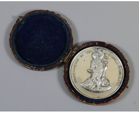 A cased French silver archery medal decorated in relief with a portrait of St Sebastian dated 1906 stamped Argent 950/1000, 6