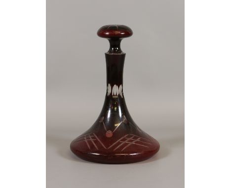 A cut ruby glass ships decanter with mushroom stopper.
