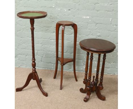 Three pieces of reproduction furniture to include wine table, jardiniere stand with tripod base and a similar example.