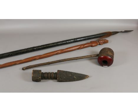 A collection of tribal items to include carved hardwood spear, smoking pipe and carved finial.