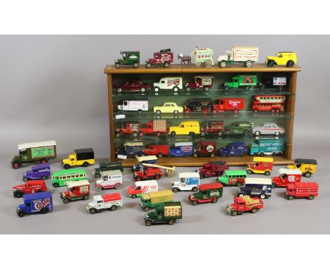 A quantity of Corgi Diecast models to include vintage ? vans held in a display case and other loose examples.