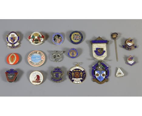 A quantity of collectable enamel badges including silver examples the Masonic institution for girls, Canadian lady bowlers Wo