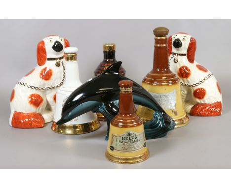 A small quantity of collectables to include a pair of Staffordshire dogs, Poole dolphin, Bells whisky decanter etc.