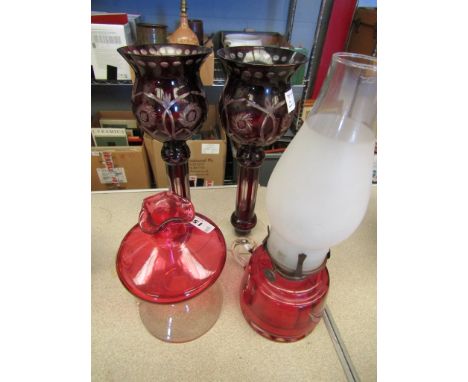 A pair of Bohemian ruby glass candle lamps, cranberry vase and oil lamp (4)