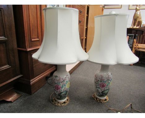 A pair of 19th Century Oriental style table lamp bases converted from a vase, hand painted bird in foliage design, ormolu bas