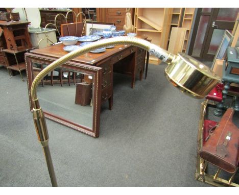 A brass adjustable reading light