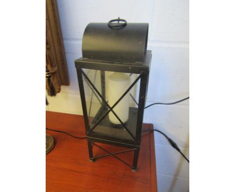 A metal cased candle style side lamp
