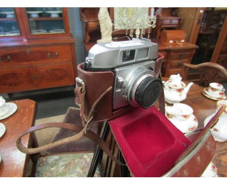 A Balda 35mm camera together with brown leather case and tripod          