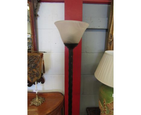 A metalwork standard lamp with twisted column