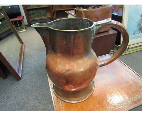 An oversized copper pitcher jug 