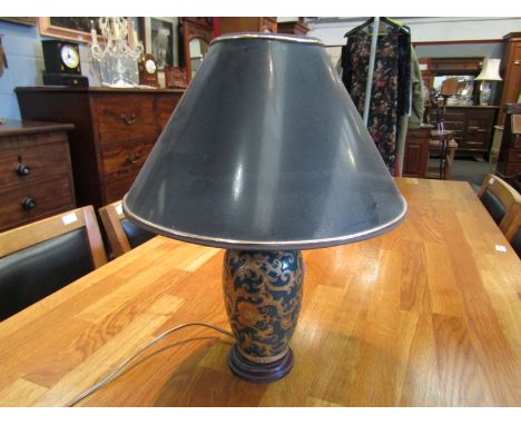 A baluster form painted lamp on wooden base