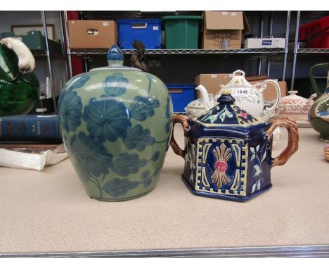 A majolica twin handled tea caddy and a spice jar 