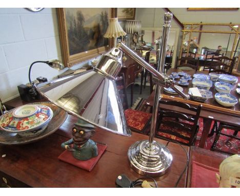 A modern adjustable chromed desk lamp