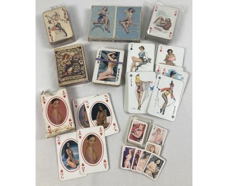 A collection of assorted adult erotic playing cards featuring pin-up and glamour models. 