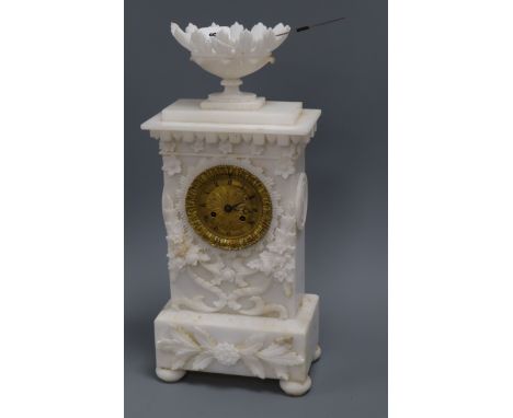 A 19th century French carved alabaster clock