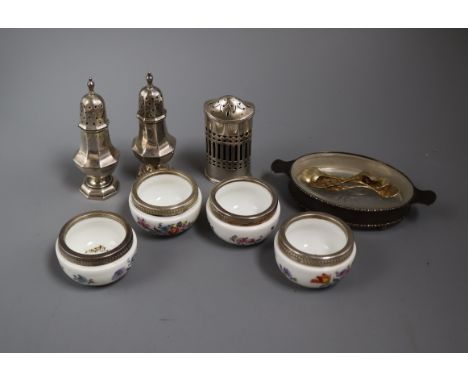 Three silver condiments, four white metal mounted ceramic salts with spoons and a mounted dish.