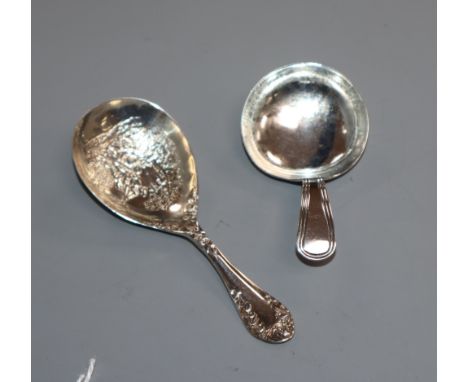 A George III silver Old English thread pattern caddy spoon and a late Victorian caddy spoon with picture bowl.