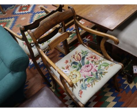A pair of Regency rosewood and simulated rosewood elbow chairs, with drop in tapestry seats