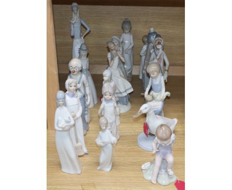 A collection of sixteen mixed Lladro style and Nao style figurines