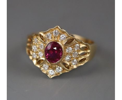 A modern pierced 14ct gold, ruby and diamond hexagonal cluster ring, size N/O.