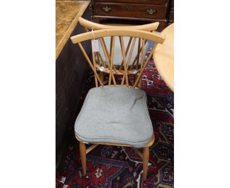 A set of four Ercol light elm candlestick chairs