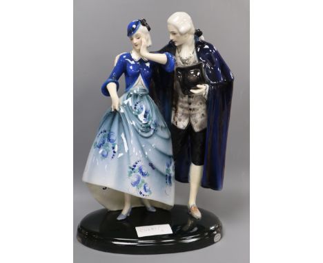 A Goldscheider group of a lady and gentleman designed by Lorenzl