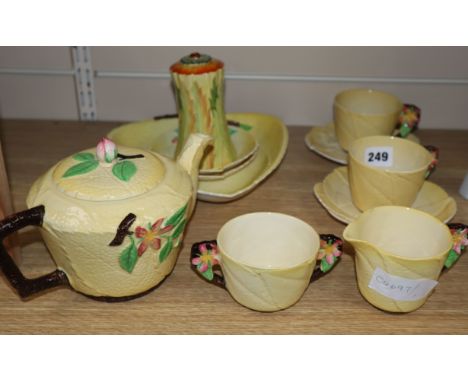 A Carltonware yellow ground teaset and sugar shaker