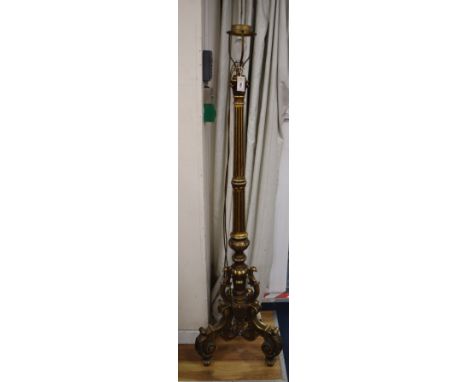 A Florentine style carved giltwood lamp standard on a tripod base H.160cm