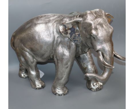 A large filled silver model of an Indian elephant (trunk down), Sheffield 1996, Camelot Silverware, height 25.3cm.