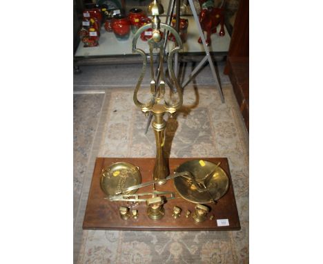 A SET OF VINTAGE BRASS SCALES AND WEIGHTS 