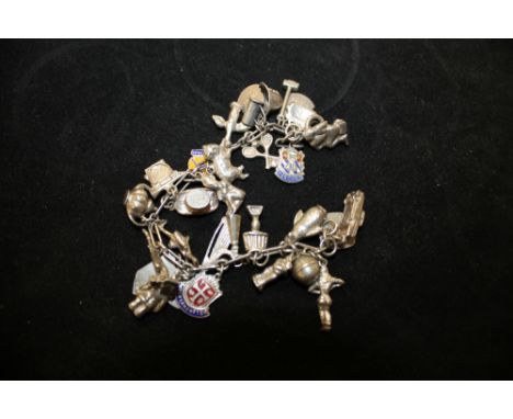 A SILVER CHARM BRACELET WITH CHARMS