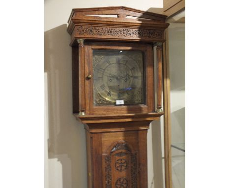 A MID 18TH CENTURY OAK CARVED LONGCASE CLOCK BY ARCHIBALD STRACHAN - NEWCASTLE, the 11" brass dial with subsidiary seconds di