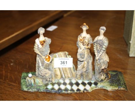 AN UNUSUAL GLAZED CERAMIC FIGURE GROUP - INITIALS TO BASE 
