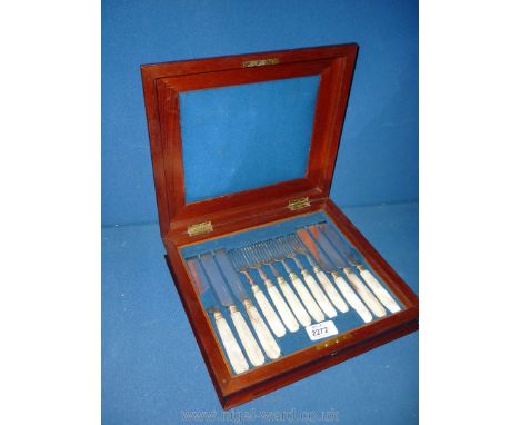 A set of 6 Victorian dessert knives and forks with mother of pearl handles, in original fitted flame mahogany case.