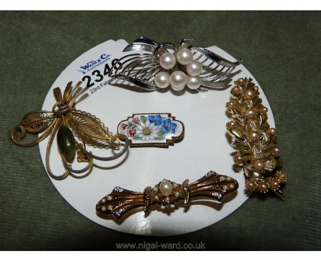 Five various brooches including sea pearls and marcasite, enamel and one being marked sterling silver.