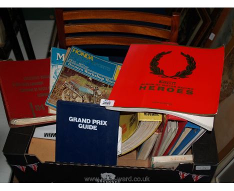 A quantity of motoring books including Honda Workshop manual, Pirelli Album of motor racing Heroes, etc.