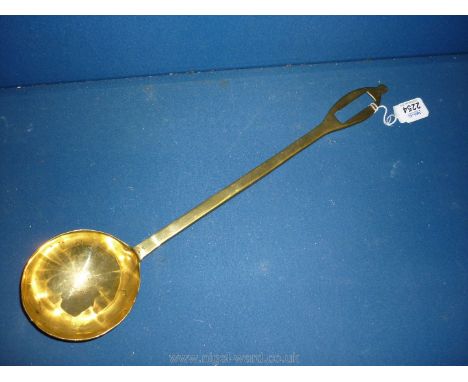 A solid Brass Ladle.
