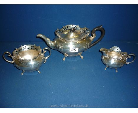 A Silver three piece Teaset comprising teapot, sugar basin and cream jug, Birmingham 1910, maker Williams of Birmingham Ltd.