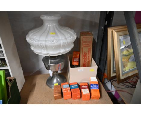 A box of oil lamp accessories together with a metal oil lamp with glass shade  