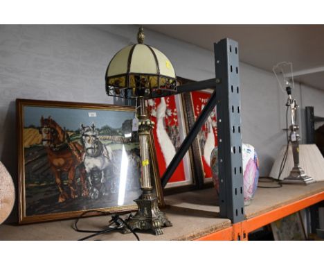 A modern decorative table lamp with glass shade