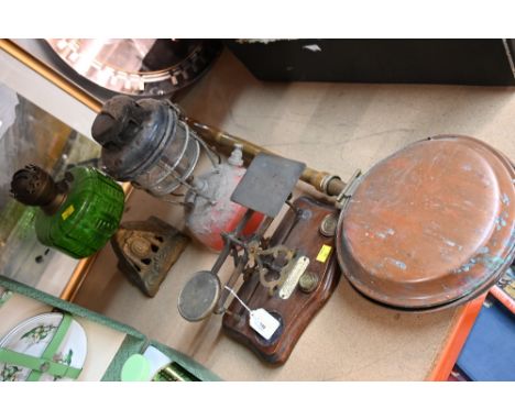 Set of postal scales, a warming pan, green glass oil lamp and a Tilley lamp