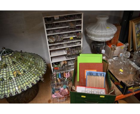 A flight of drawers containing crafting accessories together with a box of crafting tools and accessories 