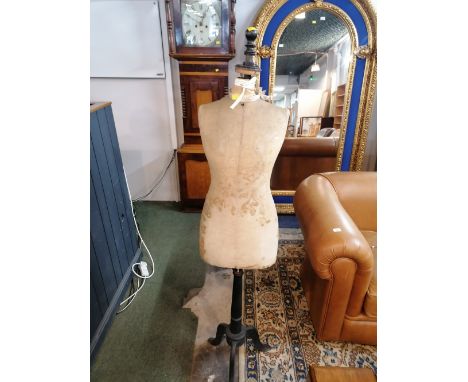 A vintage tailors dummy on black stand 